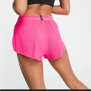 Nike Women’s AeroSwift Dri-fit mid rise size Large. Hot pink